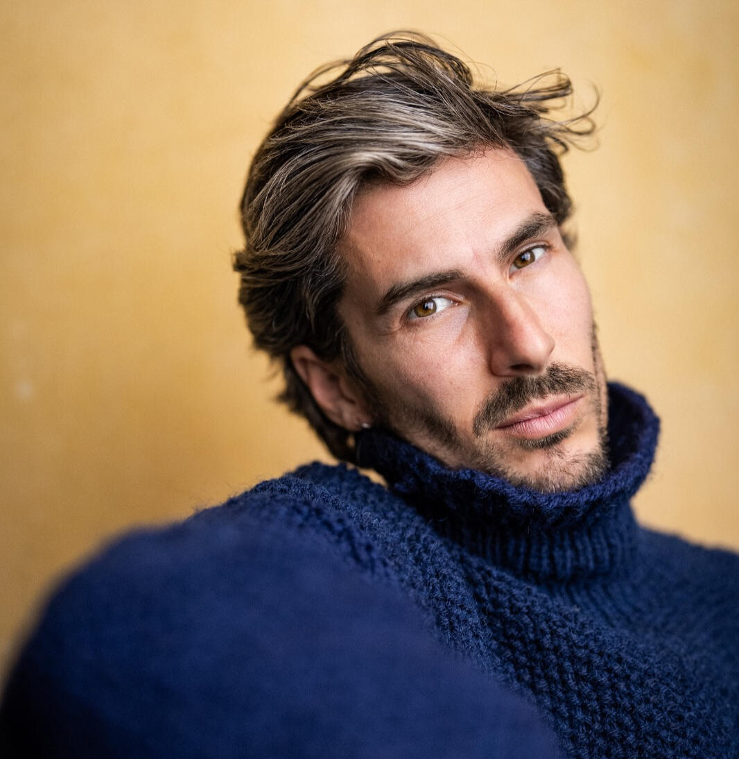 Alvaro Cea | Spanish actor based in London and Madrid Portrait of Spanish actor Álvaro Cea wearing a blue knit jumper